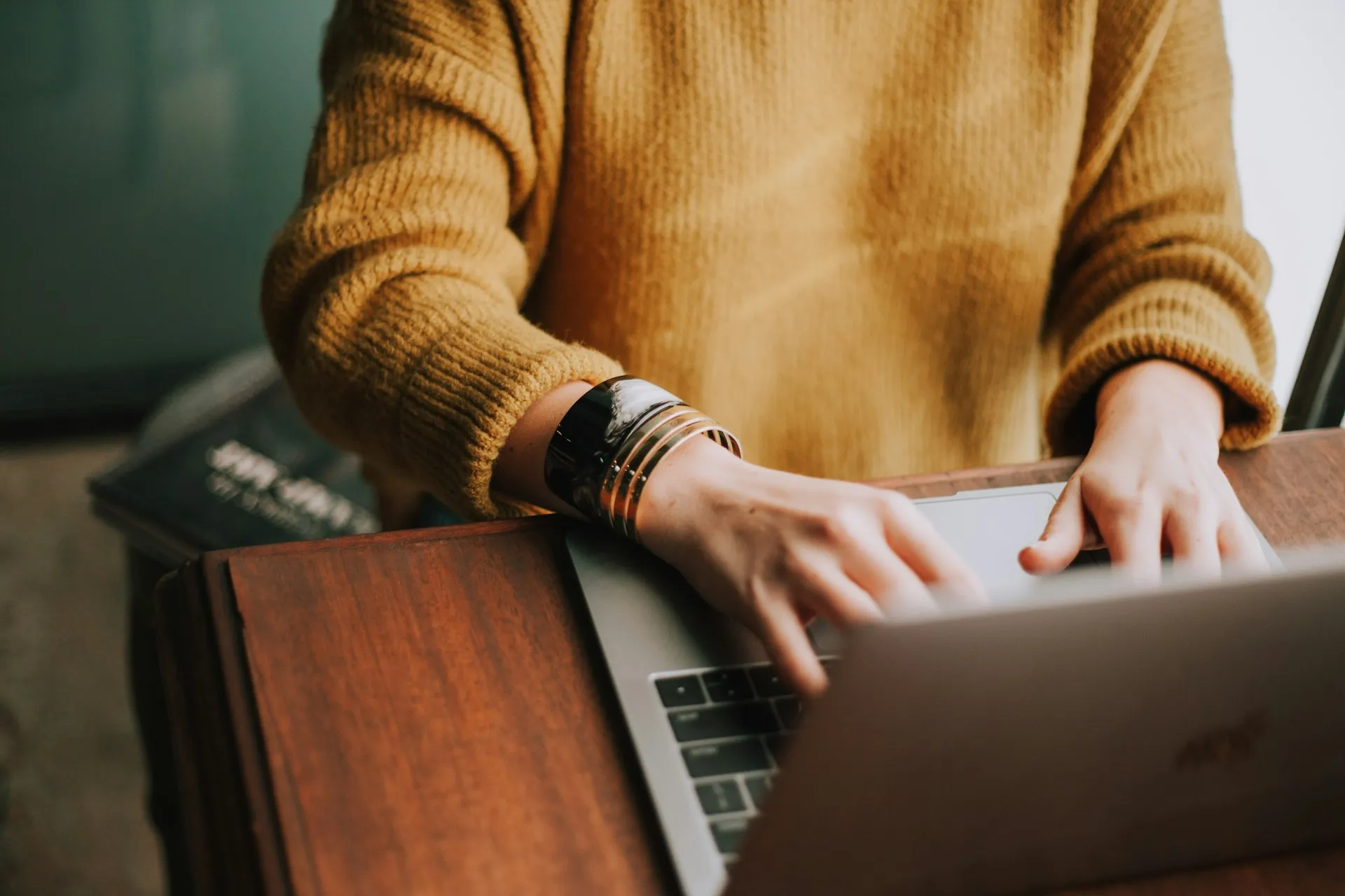 Designer working on a laptop at a desk